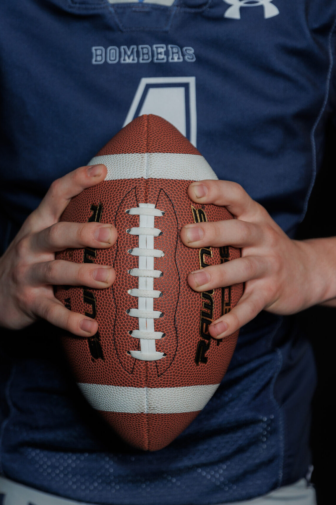 Fortis Sports Person Holding Football Close Up